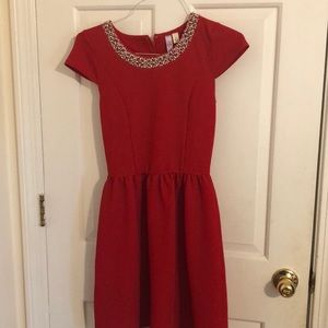 Red dress, with a beaded neckline